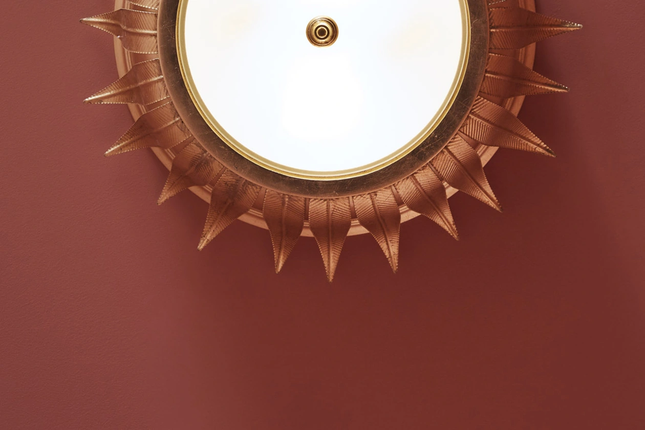 Exquisite hand-crafted ceiling design adorned with captivating embedded lighting, creating a stunning visual effect.