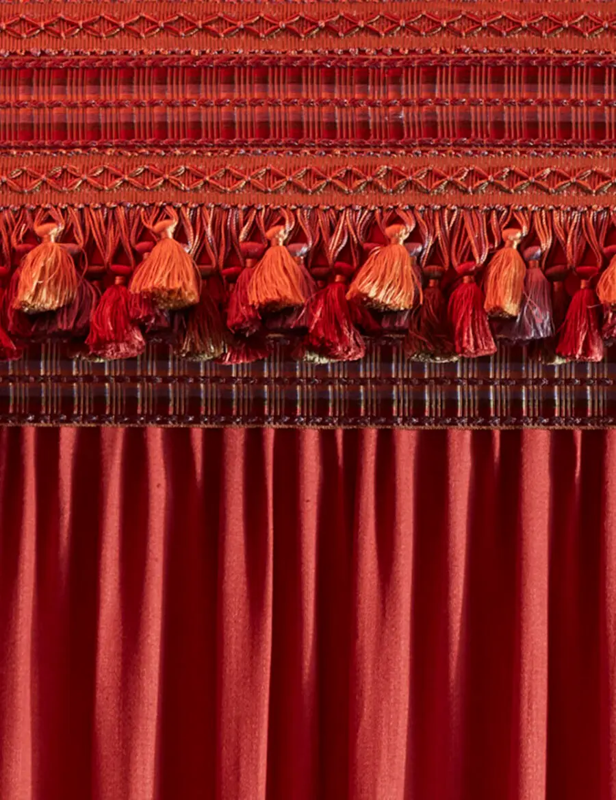 Artisanal lace intricately adorning the curtain, enhancing its elegance and charm.