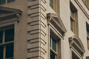 An architecturally stunning building design glowing beautifully in the sunlight.