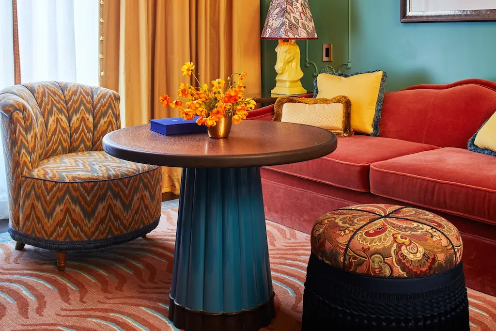 A neatly arranged living space with a cozy sofa, chair and coffee table.