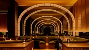 An amazingly designed restaurant interior featuring a curved, illuminated ceiling.