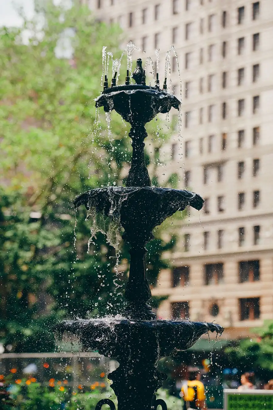 A beautifully designed water fountain outside The Fifth Avenue hotel, adding elegance to the entrance
