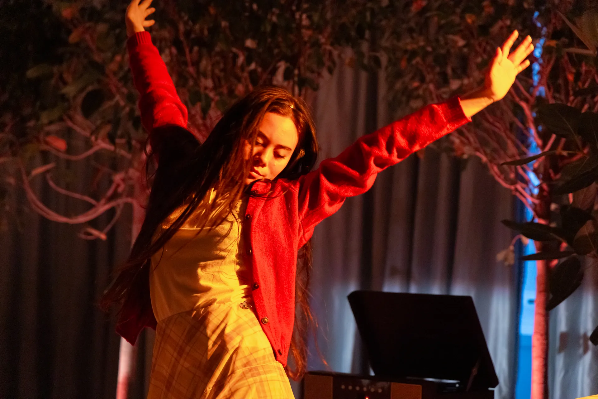 A woman gracefully dancing, expressing movement and emotion with elegance